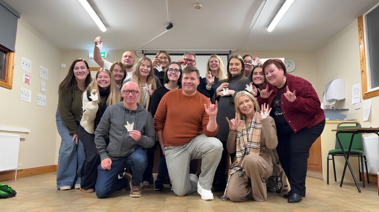 Irish sign language tutor trainees posing for the camera.